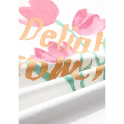 Disposable face mask featuring a soft fabric with pink floral design and the word