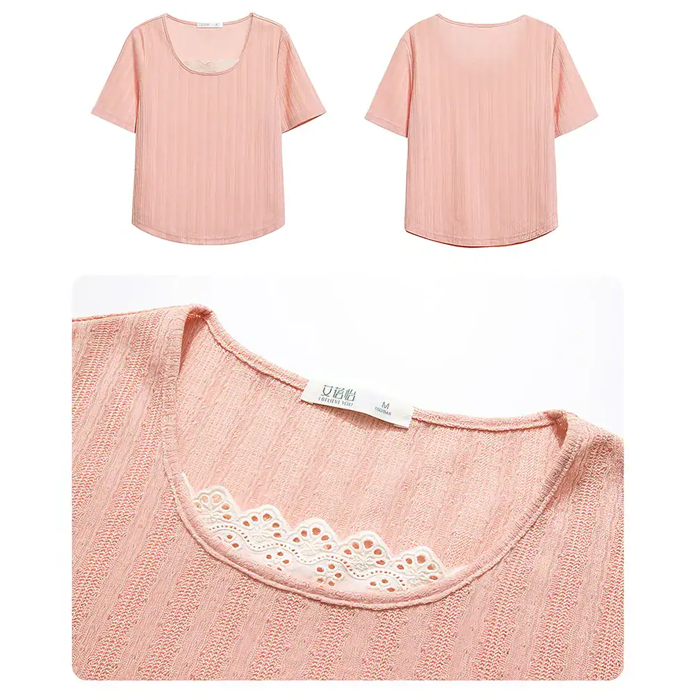 Close-up of pink women's blouse with delicate lace detail around neckline, made from lightweight, breathable fabric, perfect for casual or office wear.