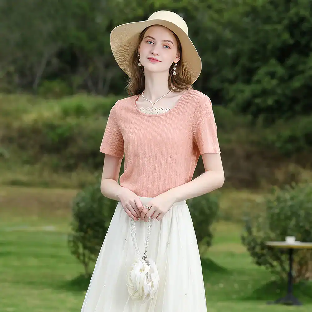 A stylish summer outfit featuring a lightweight pink T-shirt, flowing white skirt, and wide-brim straw hat perfect for outdoor activities. Ideal for women seeking fashionable, comfortable clothing for summer at Monalisa Medical Store.