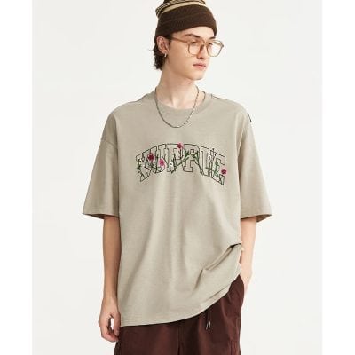 Comfortable beige oversized T-shirt featuring embroidered
