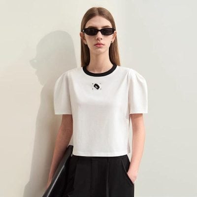 Fashionable woman wearing black sunglasses and casual outfit, showcasing stylish eyewear products at Monalisa Medical Store, perfect for modern and trendy eye accessories.