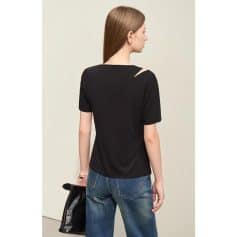 Elegant black women's top with a unique shoulder cutout, perfect for stylish occasions and everyday wear. Comfortable fit, versatile fashion choice.