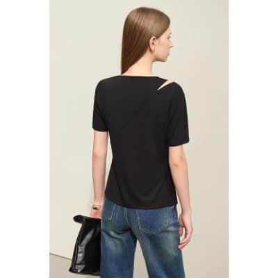 Elegant black women's top with a unique shoulder cutout, perfect for stylish occasions and everyday wear. Comfortable fit, versatile fashion choice.