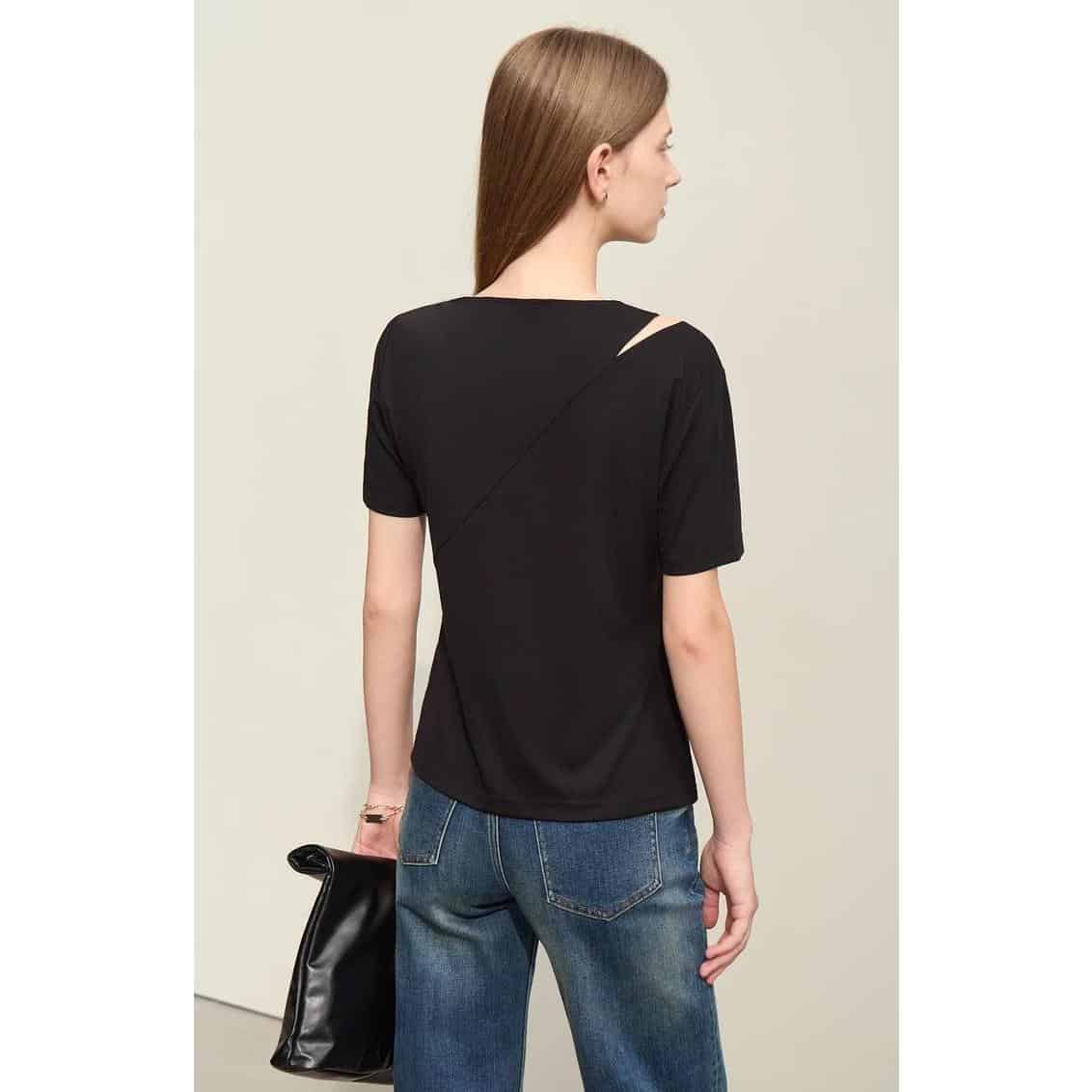 Elegant black women's top with a unique shoulder cutout, perfect for stylish occasions and everyday wear. Comfortable fit, versatile fashion choice.