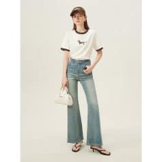 Stylish women's casual wear featuring a white graphic t-shirt, high-waisted flare jeans, and trendy accessories, perfect for modern chic looks and everyday wear.