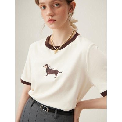 Stylish white Dachshund graphic t-shirt with brown accents, perfect for casual and trendy looks.