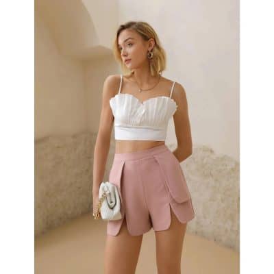 Bright casual womenswear with trendy pink shorts and a fashionable white crop top, perfect for summer looks at Monalisa Store.
