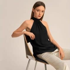 High-quality black optician sleeveless top for women, stylish and comfortable, ideal for eyewear professionals, optometrists, or fashion-forward individuals.