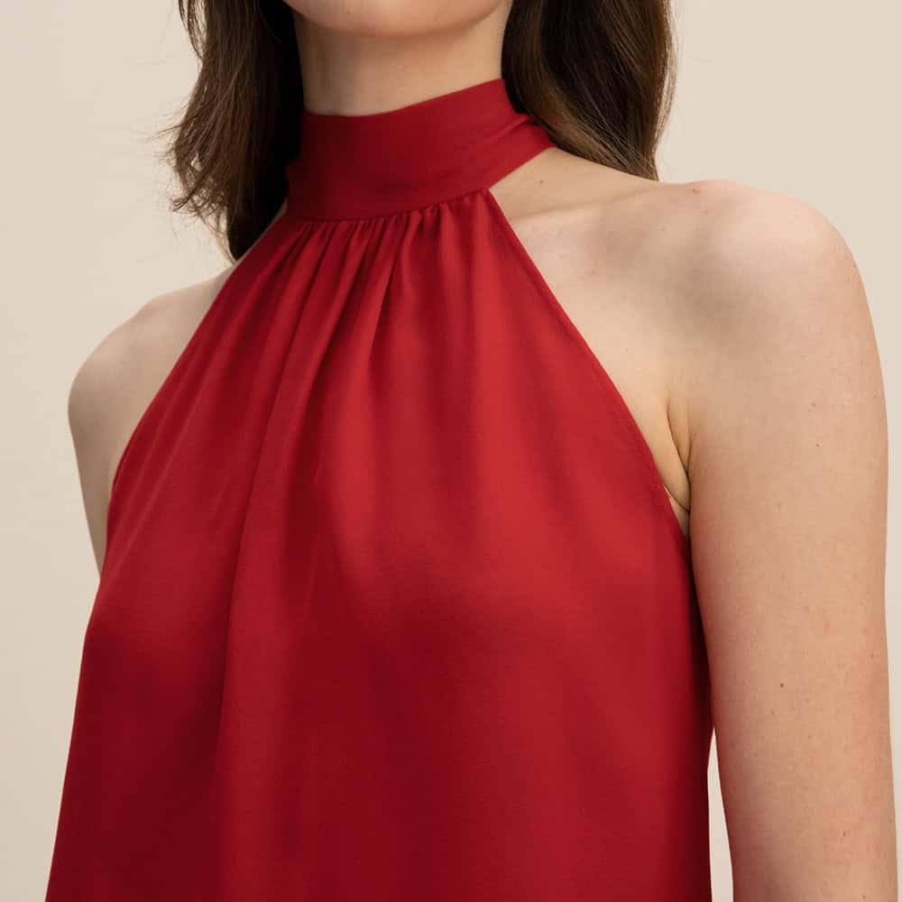 High-quality red sleeveless dress with a high neckline, perfect for fashionable occasions and casual wear. Made from soft, comfortable fabric, designed to enhance your style and confidence.