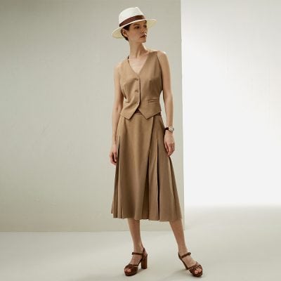 Stylish beige sleeveless vest and wide-leg pleated trousers with summer accessories, showcasing chic women's fashion from Monalisa Store.