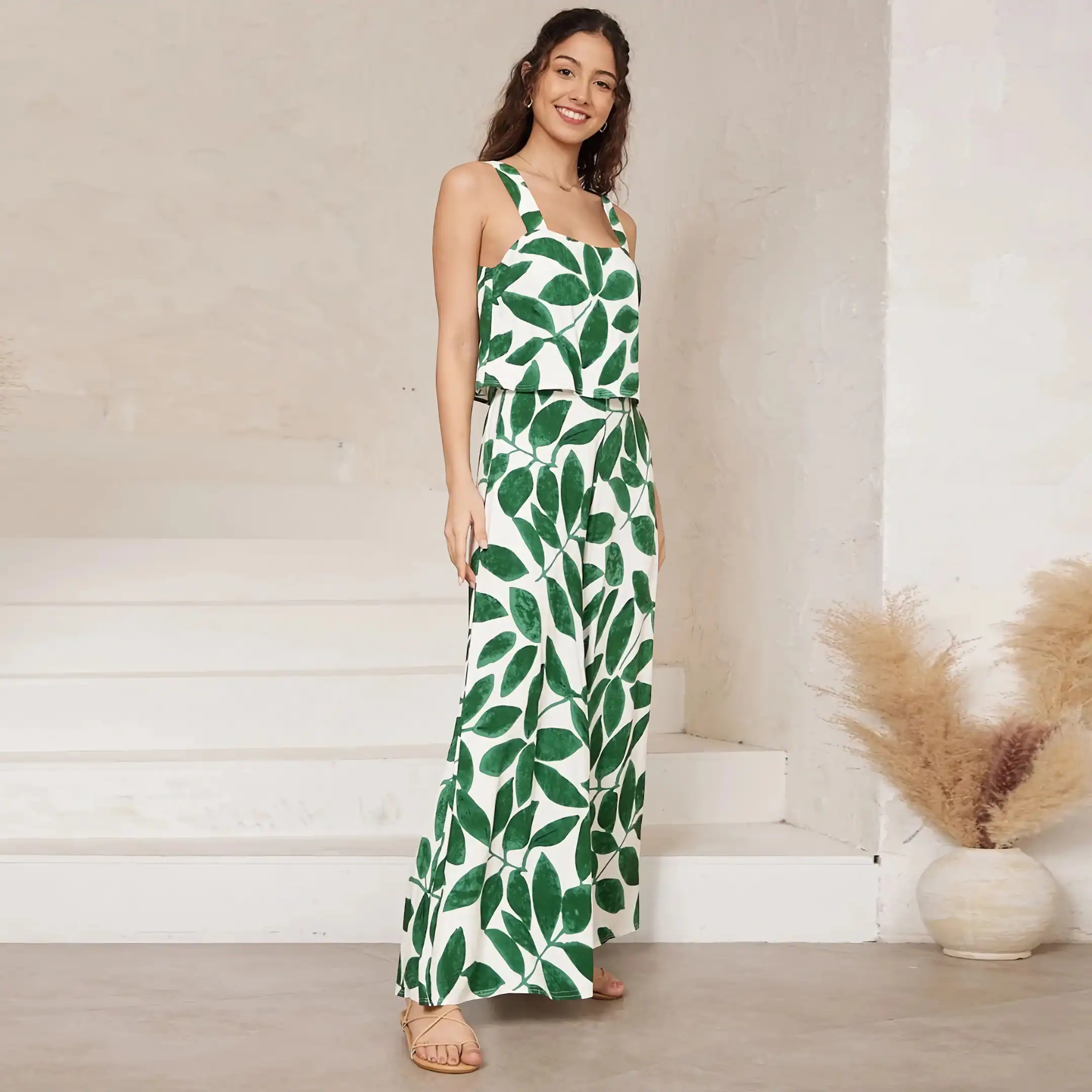 Stylish green leaf print jumpsuit from Monalisa Store, perfect for summer and casual wear. Trendy, comfortable, and ideal for outdoor events, making a fashion statement with vibrant botanical design.