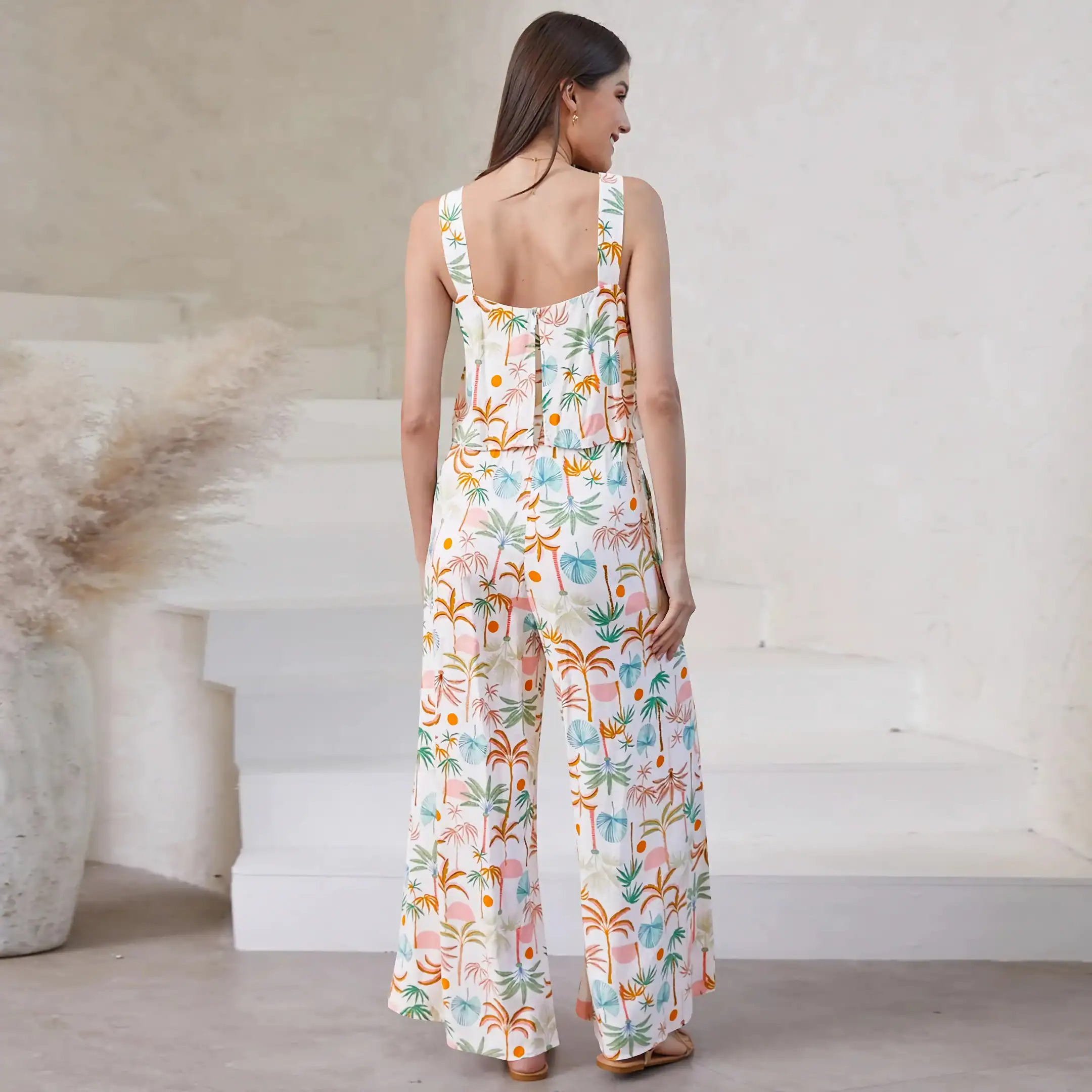 Vibrant women's summer jumpsuit with colorful tropical print, perfect for casual and vacation wear from Monalisa Store.