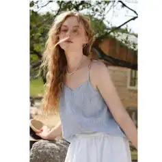 Close-up of a young woman outdoor showcasing fashionable eyewear and accessories at Monalisa Store.