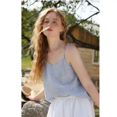 Close-up of a young woman outdoor showcasing fashionable eyewear and accessories at Monalisa Store.