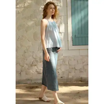 Light blue tank top with distressed jeans and sandals, perfect for casual summer days. Showcasing trendy, comfortable fashion from Monalisa Store.