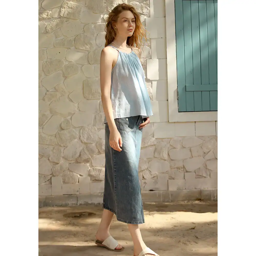 Light blue tank top with distressed jeans and sandals, perfect for casual summer days. Showcasing trendy, comfortable fashion from Monalisa Store.