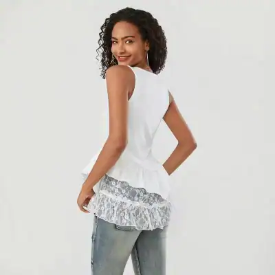 Elegant white sleeveless blouse with lace ruffle detail, perfect for casual or semi-formal occasions. Made from high-quality fabric, offers a chic and comfortable fit.