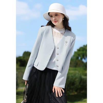 Stylish women's blazer, white jacket, and fashionable accessories showcased outdoors, perfect for office or casual wear.