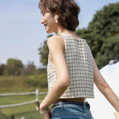 Elegant sleeveless checkered top for women, perfect for casual and summer wear. Comfortable fit with fashionable design suitable for all occasions.