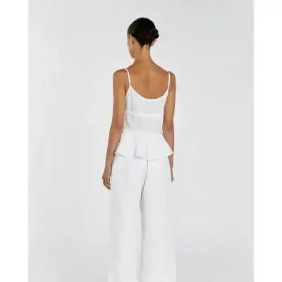 Women’s white linen sleeveless top with adjustable straps and matching wide-leg trousers, perfect for summer wear and casual outings.