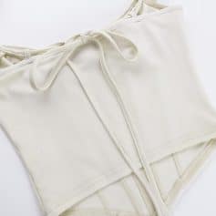 Comfortable white lace-up top with a stylish design, perfect for casual or professional wear, available at Monalisa Medical Store.