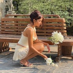 Elegant woman wearing stylish eyewear from Monalisa Store in an outdoor setting, showcasing trendy glasses and sunglasses perfect for fashion-conscious individuals.