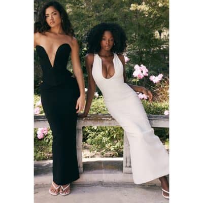 Stylish black and white formal gowns with fitted silhouettes and deep neckline designs.