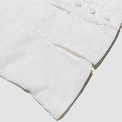 High-quality white embroidered linen with delicate floral patterns, perfect for home decor or special occasions. Soft, durable, and stylish for versatile use.