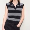 A trendy black and white striped sleeveless top with a collared neckline, perfect for casual or office wear, designed for a flattering fit in women's fashion.