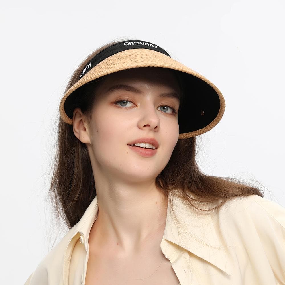 Stylish beige wide-brim sun visor with black trim, perfect for summer outdoor eyes protection. Trendy accessory for beach, travel, or casual wear from Monalisa Medical.