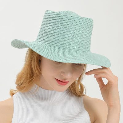 Light blue wide-brim straw hat for sun protection, perfect for outdoor activities and summer fashion.