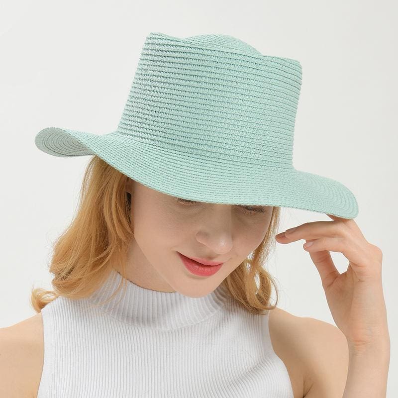 Light blue wide-brim straw hat for sun protection, perfect for outdoor activities and summer fashion.