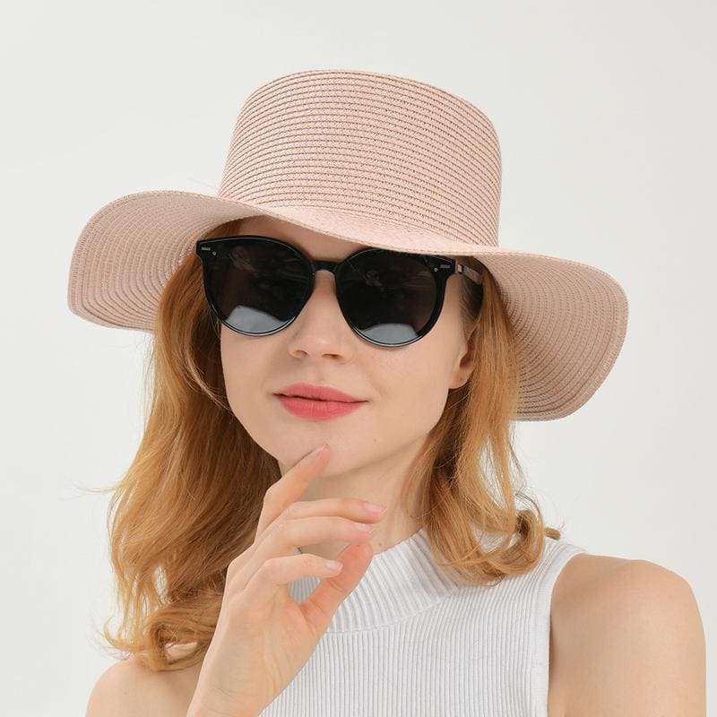 Elegant wide-brim sun hat for women, perfect for summer and outdoor activities, offers UV protection and chic style. Ideal for beach outings, travel, and casual wear.