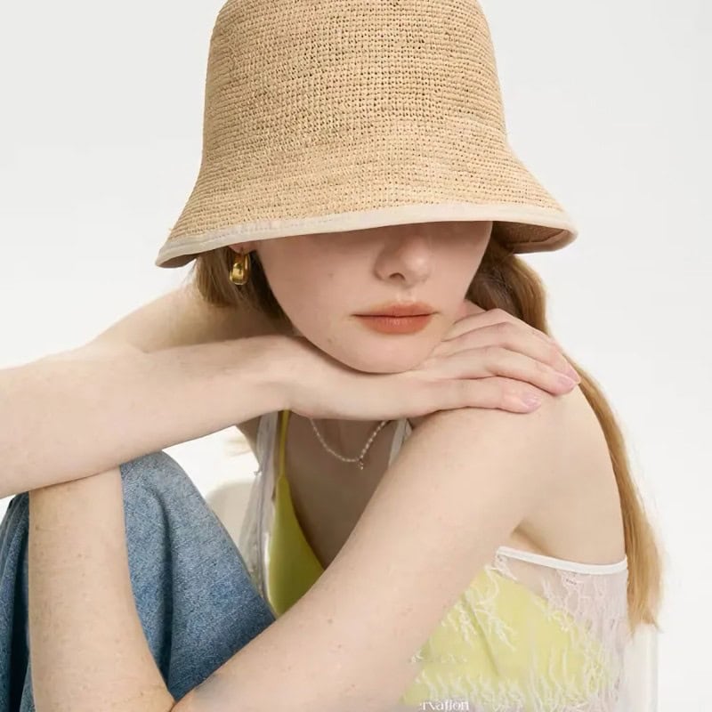 Elegant young woman wearing a straw hat and yellow dress, showcasing feminine style and fashion accessories. Perfect for opt, fashion, and lifestyle images.