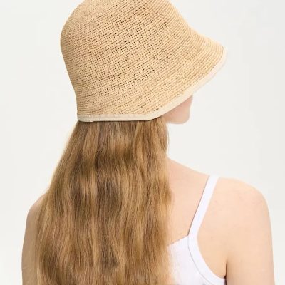 Stylish beige straw hat perfect for sun protection and fashion during summer. Lightweight, breathable, and fashionable accessory for outdoor activities and beach days.