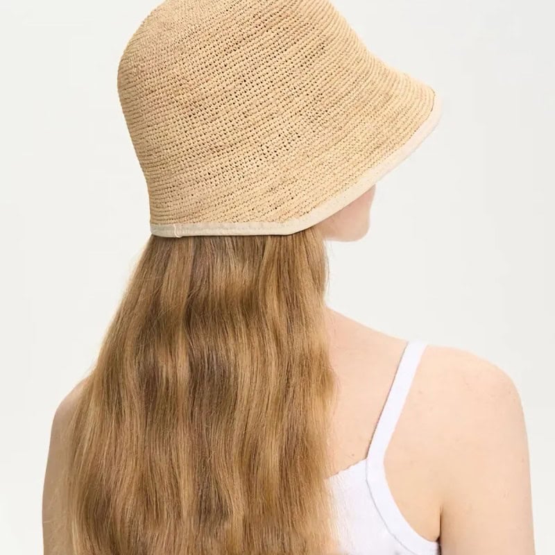 Stylish beige straw hat perfect for sun protection and fashion during summer. Lightweight, breathable, and fashionable accessory for outdoor activities and beach days.