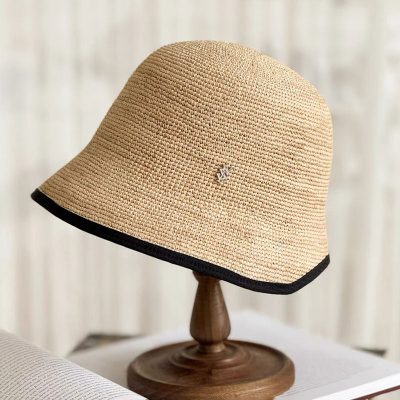 Decorative straw sun hat with black trim, perfect for summer outings, beach days, or casual outdoor activities. Lightweight and breathable for comfortable sun protection.