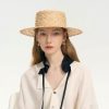 Stylish straw hat featuring a wide brim, perfect for sun protection and fashionable summer accessorizing. Ideal for outdoor outings, vacations, or casual chic looks.