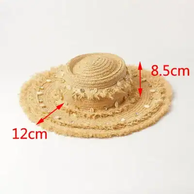 Stylish straw hat with seashell embellishments, perfect for summer and beach outings, offering sun protection and trendy fashion.
