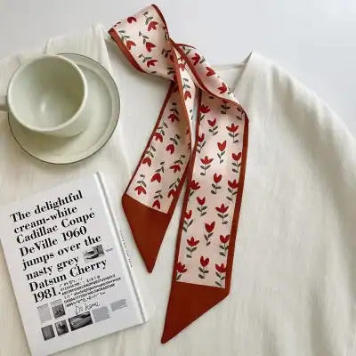 Stylish red and white floral printed scarf with a satin finish, perfect for accessories and fashion.