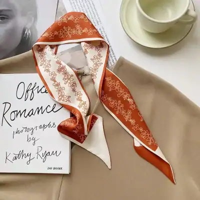 Silk scarf with floral print ideal for styling eyewear and enhancing optical shop displays. Perfect for fashion-forward optical stores showcasing stylish accessories.