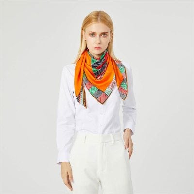 Bright colorful women's silk scarf with intricate patterns, versatile and stylish accessories for fashion-conscious women and eyewear boutique shoppers.