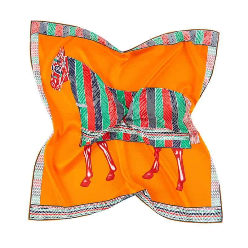 Luxurious silk scarf featuring a vibrant, multicolored horse design perfect for premium fashion accessories. Elegant, high-quality material ideal for enhancing your stylish wardrobe with a unique touch.