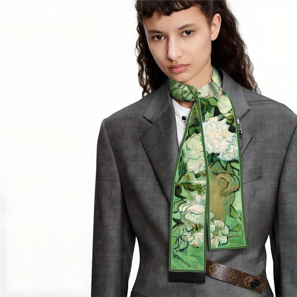 A stylish floral scarf with vibrant green and white flowers, ideal for enhancing women's business or casual attire. Made from high-quality fabric, it offers both comfort and elegance.