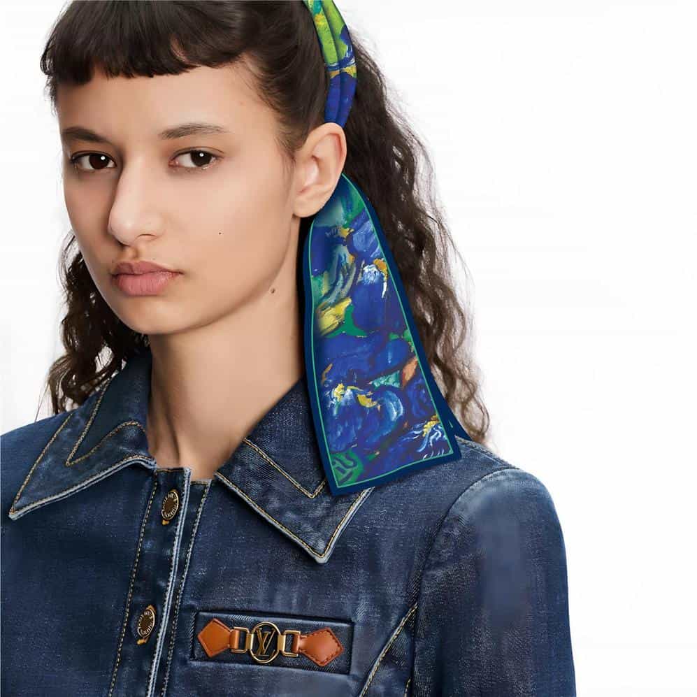 A trendy, colorful silk scarf worn by a young woman, perfect for adding a touch of elegance to any outfit, available at Monalisa Store for fashionable accessories.