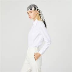 Stylish woman in white shirt and headscarf, perfect for eye care fashion or optical store branding. Elegant and modern look suitable for optometry or ophthalmology branding.
