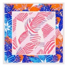 Bright tropical leaf print scarf featuring bold pink, orange, blue, and purple hues, perfect for stylish summer accessories or gift options.