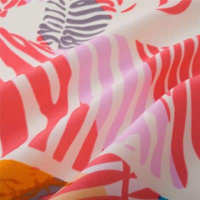 Bright, colorful fabric with pink, red, orange, and purple patterns, perfect for foldable sunglasses, eyewear cases, or accessories at Monalisa Medical store.