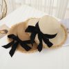 Elegant wide-brim straw hats with black ribbons, perfect for sun protection and fashion. Ideal accessories for the beach, vacation, or outdoor events to enhance your summer wardrobe.