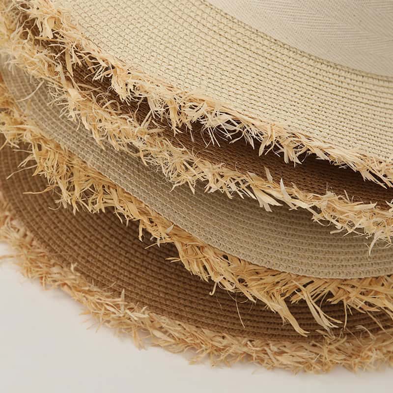 Comfortable straw hats with frayed edges, perfect for sunny days and casual outings. Stylish and breathable, ideal for summer fashion.